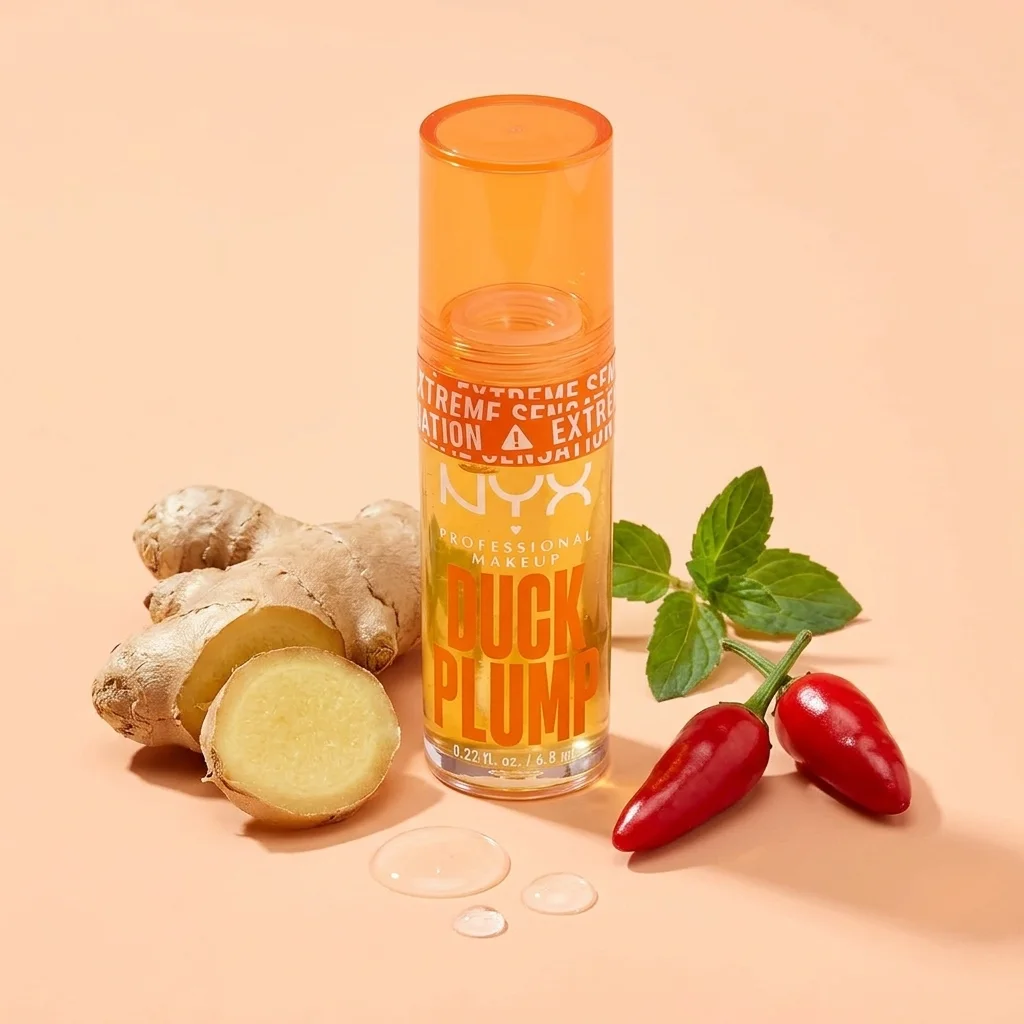 Gloss voluminizador de labios rodeado de raíz de jengibre y guindillas rojas (capsicum)
